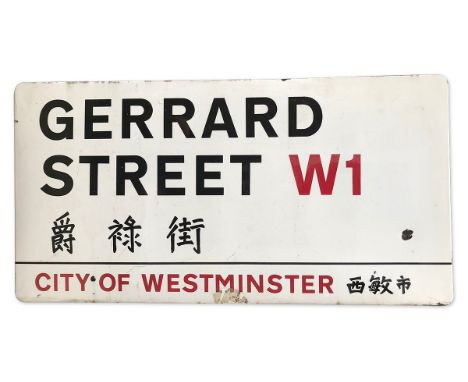 An enamelled iron street sign for Gerrard Street W1 Chinatown, City of Westminster with iconic black and red sans serif lette