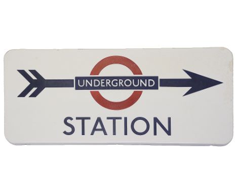 A London Underground enamel direction sign displaying 'UNDERGROUND / STATION',blue lettering on white ground, 'UNDERGROUND' c