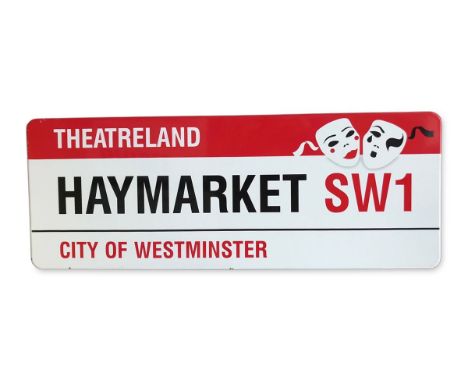 An enamelled iron street sign for Haymarket SW1 TheatrelandCity of Westminster with iconic black and red sans serif lettering