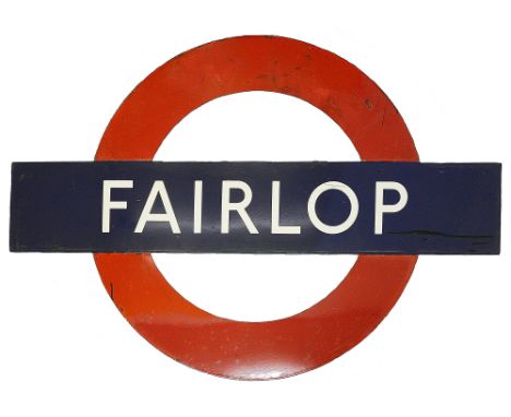 A London Underground enamel station roundel for Fairlop,in three parts consisting of nameplate of white lettering on blue gro