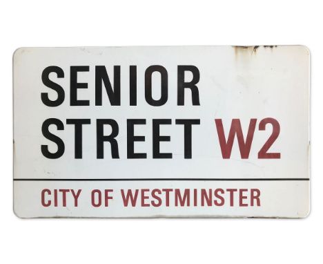 An enamelled iron street sign for Senior Street W2, City of Westminster with iconic black and red sans serif lettering first 