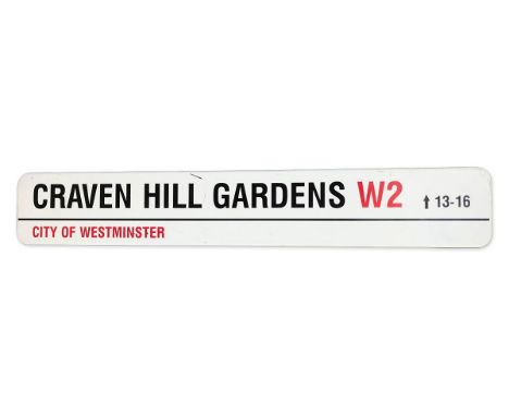 An enamelled iron street sign for Craven Hill Gardens W2, City of Westminsterwith iconic black and red sans serif lettering f