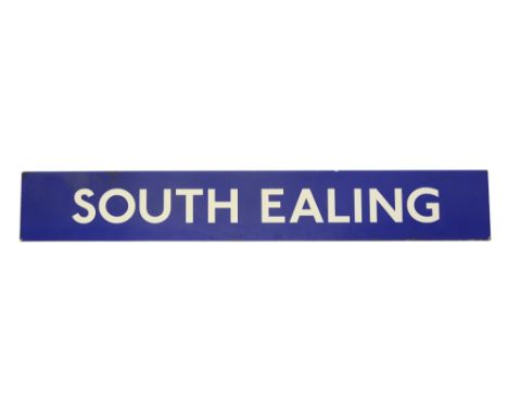 A London Underground enamel station sign displaying 'SOUTH EALING',white lettering on a blue ground, label on the back for 'A