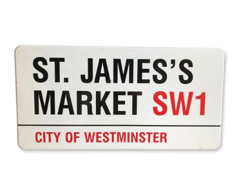 An enamelled iron street sign for St James's Market SW1, City of Westminster with iconic black and red sans serif lettering f