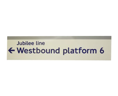 A London Underground enamel direction sign displaying 'Jubilee line / Westbound platform 6',with left facing arrow, blue lett