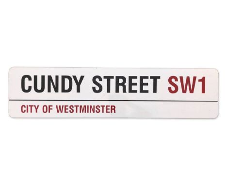 An enamelled iron street sign for Cundy Street SW1, City of Westminster with iconic black and red sans serif lettering first 