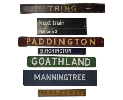 A group of enamel, metal, wooden and cardboard Railway-related signs,comprising a double-sided painted wooden destination sig