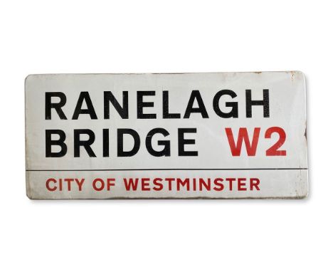 An enamelled iron street sign for Ranelagh Bridge W2, City of Westminster with iconic black and red sans serif lettering firs