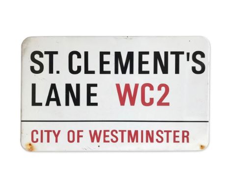 An enamelled iron street sign for St. Clement's Lane WC2, City of Westminster with iconic black and red sans serif lettering 