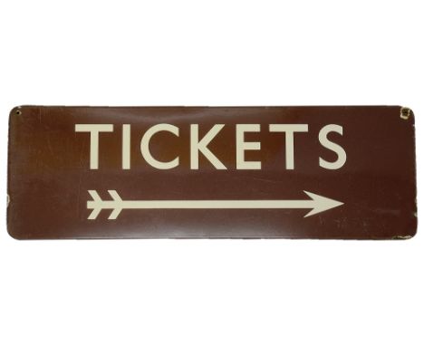 A BR(M) enamel directional sign displaying 'TICKETS',with white letters on a maroon ground, and a double-flighted arrow facin
