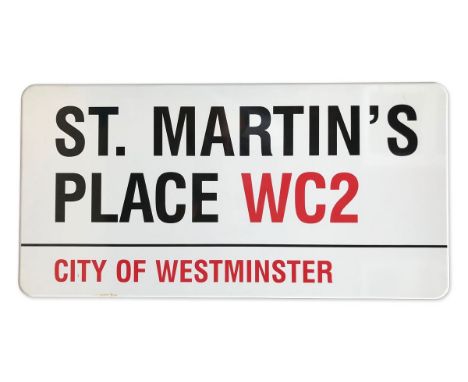 An enamelled iron street sign for St Martin's Place WC2, City of Westminster with iconic black and red sans serif lettering f