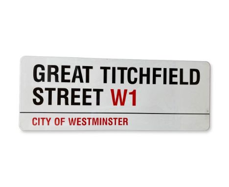 An enamelled iron street sign for Great Titchfield Street W1, City of Westminster with iconic black and red sans serif letter