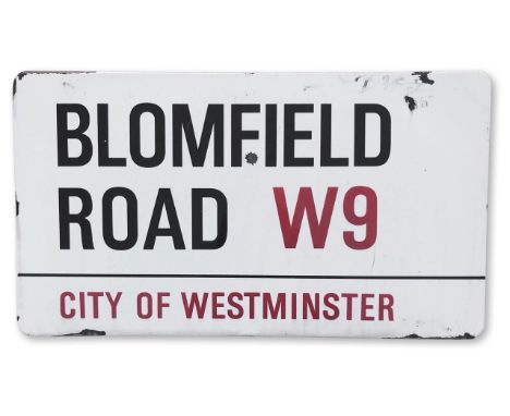 An enamelled iron street sign for Blomfield Road W9, City of Westminster, with iconic black and red sans serif lettering firs