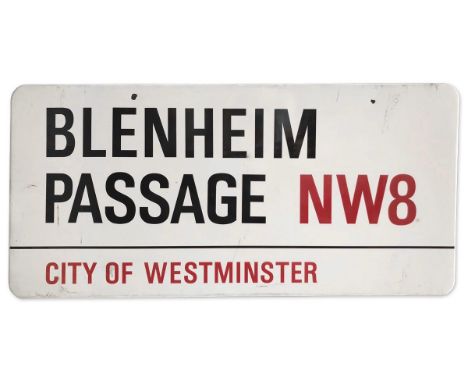 An enamelled iron street sign for Blenheim Passage NW8, City of Westminster with iconic black and red sans serif lettering fi