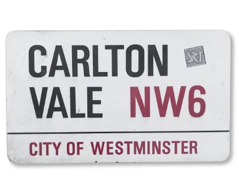 An enamelled iron street sign for Carlton Vale NW6, City of Westminster, with iconic and black and red sans serif lettering f