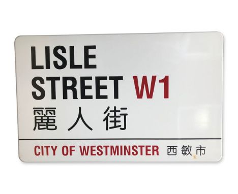 An enamelled iron street sign for Lisle Street W1 Chinatown, City of Westminster with iconic black and red sans serif letteri