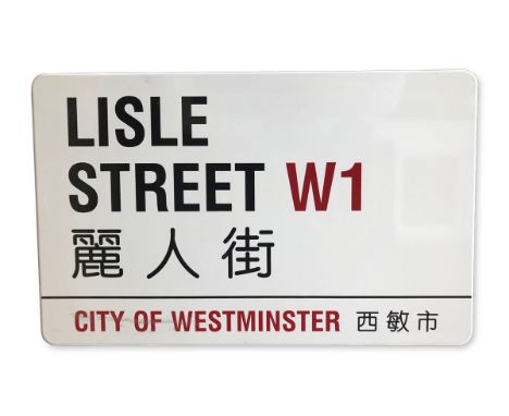 An enamelled iron street sign for Lisle Street W1 Chinatown, City of Westminster with iconic black and red sans serif letteri