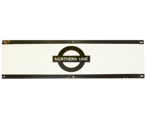 A London Underground enamel station frieze sign for 'NORTHERN LINE',black edging and roundel on white ground,height 22.9cm, w