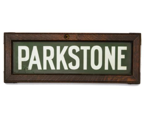 A Southern Railway Lamp Tablet Sign for Parkstone station,with opaque green glass contained within an oak frameheight 16.3cm,