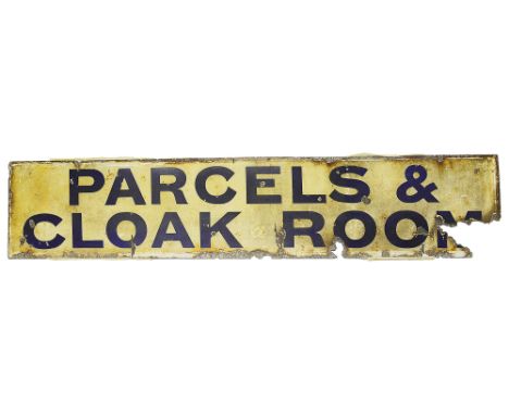 A Railway station Parcels &amp; Cloak Room enamel sign,blue lettering on a cream groundheight 23.5cm, widdth 121.7cmCondition