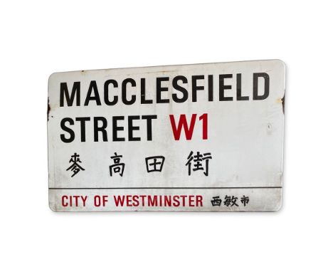 An enamelled iron street sign for Macclesfield Street W1 Chinatown, City of Westminster with iconic black and red sans serif 