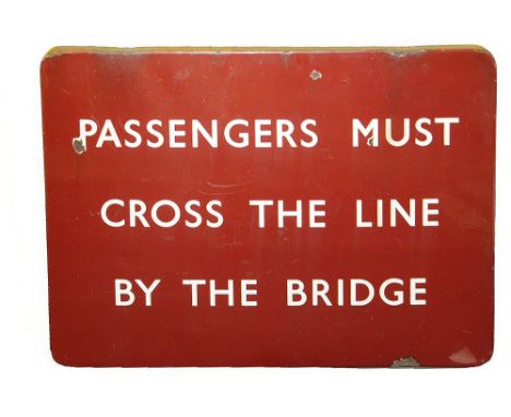 A BR(M) enamel sign displaying 'PASSENGERS MUST CROSS THE LINE BY THE BRIDGE',with white lettering on maroon groundheight 46c