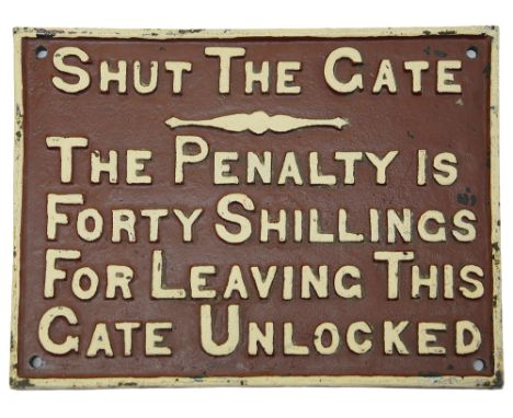 A vintage cast iron sign displaying 'SHUT THE GATE','THE PENALTY IS / FORTY SHILLINGS / FOR LEAVING THIS / GATE UNLOCKED', wh