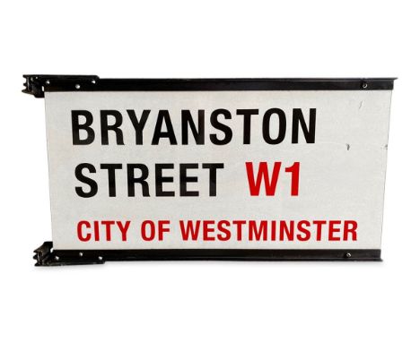 A double sided small street sign on brackets for Bryanston Street W1, City of Westminsterwith iconic black and red sans serif