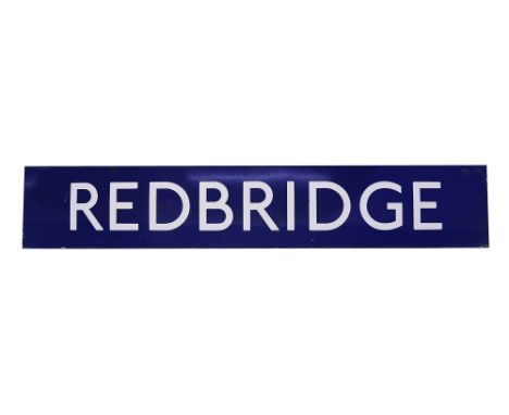 A London Underground enamel station sign for Redbridge,white lettering on a blue groundheight 27cm, width 149.5cmCondition: s