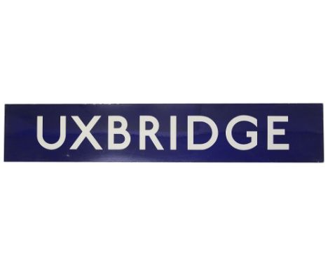 A London Underground enamel station sign for Uxbridge,with white lettering on a blue groundheight 27cm, width 144.5cmConditio