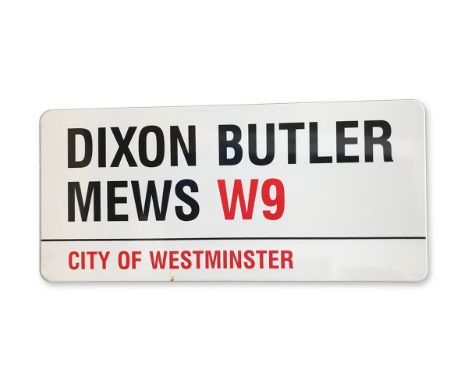 An enamelled iron street sign for Dixon Butler Mews W9, City of Westminster with iconic black and red sans serif lettering fi