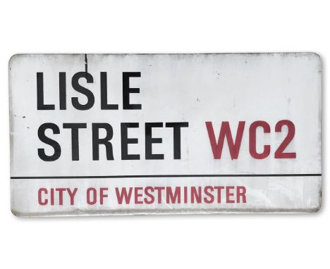 An enamelled iron street sign for Lisle Street WC2, City of Westminster, with iconic and black and red sans serif lettering f