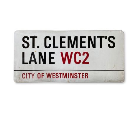 An enamelled iron street sign for St. Clement's Lane WC2, City of Westminster with iconic black and red sans serif lettering 
