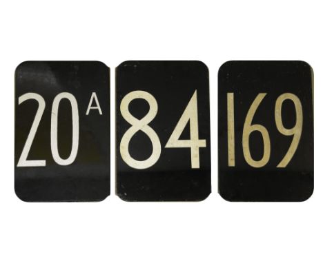 Three bus route number plates,metal plates with printed/painted numbers, one double sided for route number 29/84, the others 