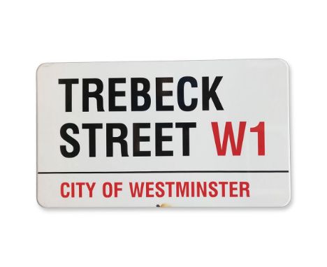 An enamelled iron street sign for Trebeck Street W1, City of Westminster with iconic black and red sans serif lettering first