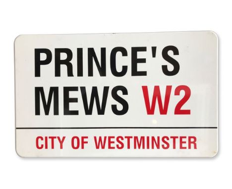 An enamelled iron street sign for Prince's Mews W2City of Westminster with iconic black and red sans serif lettering first cr