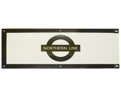 A London Underground enamel station frieze sign for 'NORTHERN LINE',black edging and roundel on white ground,height 23cm, wid