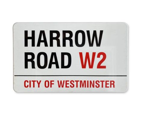 An enamelled iron street sign for Harrow Road W2, City of Westminster with iconic black and red sans serif lettering first cr