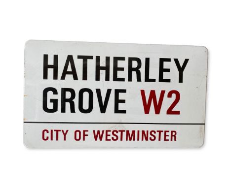 An enamelled iron street sign for Hatherley Grove W2, City of Westminster with iconic black and red sans serif lettering firs