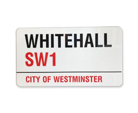 An enamelled iron street sign for Whitehall SW1, City of Westminster with iconic black and red sans serif lettering first cre
