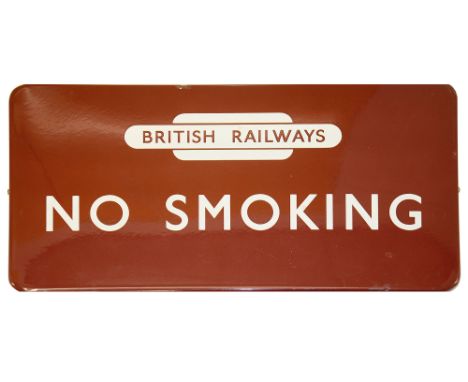 A BR(M) enamel sign displaying 'NO SMOKING' with British Railways totem,white lettering on maroon groundheight 30.8cm, width 