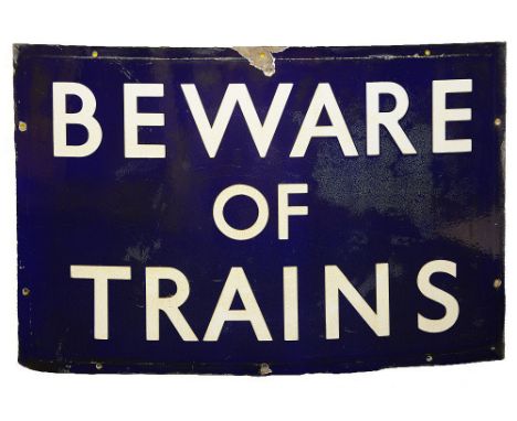 A BR(E) enamel sign displaying 'BEWARE OF TRAINS',with white lettering on a blue groundheight 45.8cm, width 68.5cmCondition: 