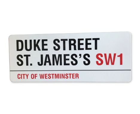 An enamelled iron street sign for Duke Street St. James's SW1, City of Westminster with iconic black and red sans serif lette