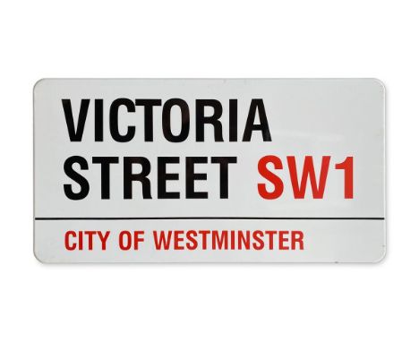 An enamelled iron street sign for Victoria Street SW1, City of Westminster with iconic black and red sans serif lettering fir