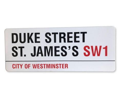 An enamelled iron street sign for Duke Street St. James's SW1, City of Westminster with iconic black and red sans serif lette