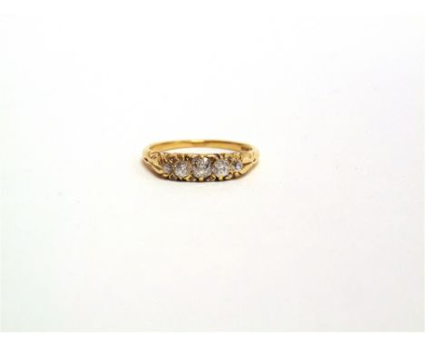 A LATE VICTORIAN FIVE STONE RING stamped '18ct', the graduated old brilliant cuts totalling approximately 0.43 carats, with r