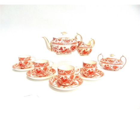 A  ROYAL CROWN DERBY PART TEA SERVICE  in the 'Victoria' pattern comprising teapot, milk jug, sucrier and four cups and sauce