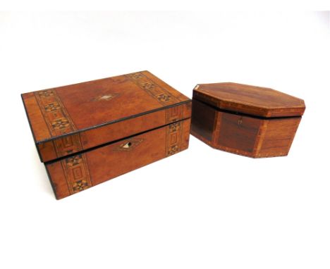 A VICTORIAN ROSEWOOD TEA CADDY OF LOZENGE FORM  with crossbanded and parquetry inlaid decoration, 28cm wide 14cm deep 15cm hi