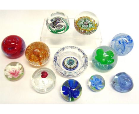 A COLLECTION OF ELEVEN GLASS PAPERWEIGHTS AND A DISH  including a faceted glass millefiore paperweight dated '1972' in the ca