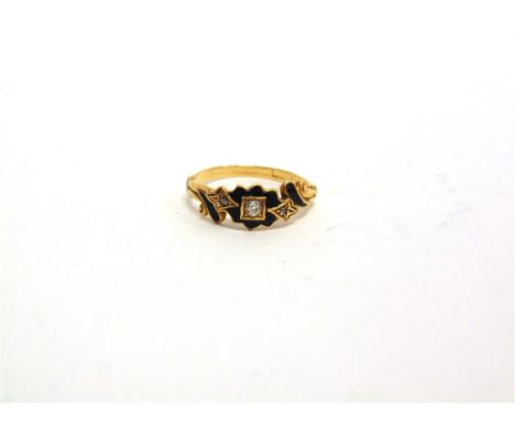 A VICTORIAN DIAMOND AND BLACK ENAMEL (MOURNING RING) the central old brilliant cut of approximately 0.05 carats, flanked by a